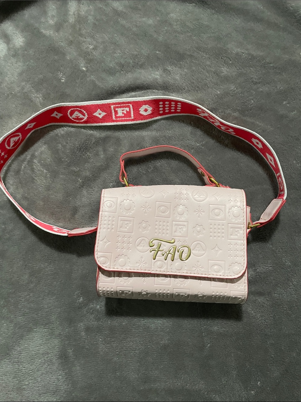 FAO Schwarz Pink Embossed Flap Bag with Red Logo Strap